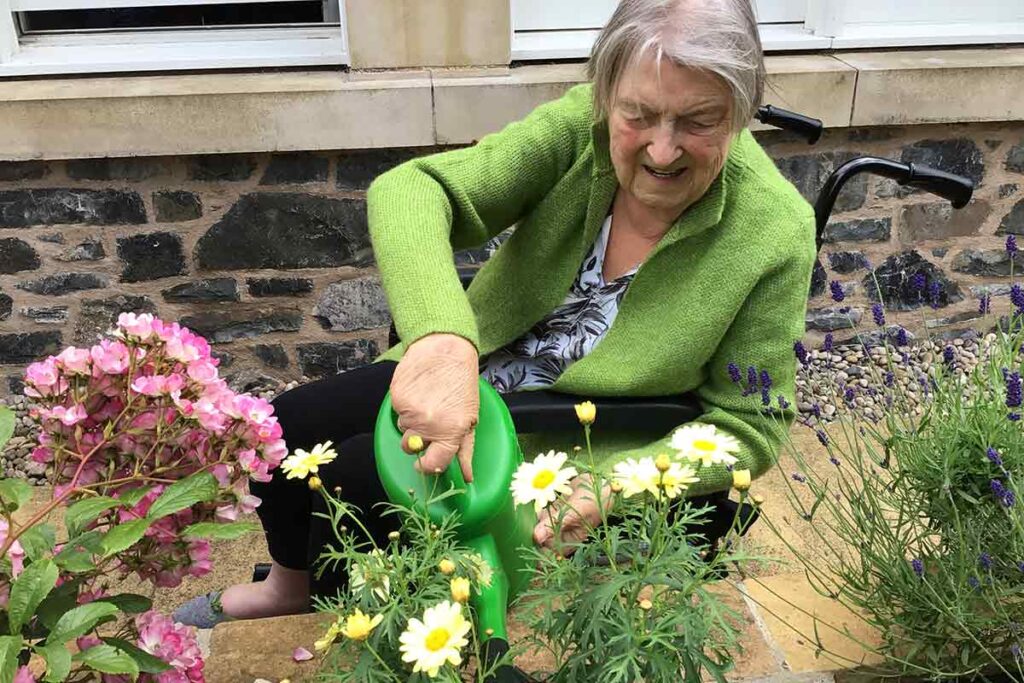 peebles watering flower border